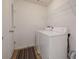 Functional laundry room with full-size washer and dryer, storage, and easy access at 2210 Benidorm Ct, South Fulton, GA 30349
