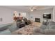An open-concept living room features neutral walls and views into the fireplace and kitchen at 2210 Benidorm Ct, South Fulton, GA 30349