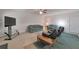 Spacious living room features neutral paint, with various seating options and large windows at 2210 Benidorm Ct, South Fulton, GA 30349