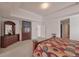 Spacious main bedroom with neutral walls, tray ceiling and view into hallway at 2210 Benidorm Ct, South Fulton, GA 30349