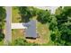 Aerial shot showcasing the layout of the home, yard, and surrounding greenery at 276 Indian Creek Dr, Powder Springs, GA 30127