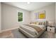 Stylish bedroom with a platform bed, wood flooring, a large window, and modern decorative art at 276 Indian Creek Dr, Powder Springs, GA 30127