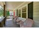 Relaxing front porch with comfortable seating and views of the neighborhood at 276 Indian Creek Dr, Powder Springs, GA 30127