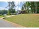 Charming two-story home with a bright red front door and well-maintained lawn at 276 Indian Creek Dr, Powder Springs, GA 30127