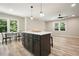 Kitchen island features white counter top and pendant lighting with chairs and eat-in kitchen at 276 Indian Creek Dr, Powder Springs, GA 30127