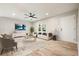Open living room showcasing a modern white couch, contemporary decor, recessed lighting, and wood floors at 276 Indian Creek Dr, Powder Springs, GA 30127