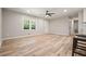 Large open living space with hardwood floors, bright natural light, and lots of space to make it your own at 276 Indian Creek Dr, Powder Springs, GA 30127