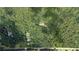 Aerial view of a home nestled among lush trees and foliage at 7448 Berea Road, Winston, GA 30187