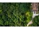 Aerial view of the home showing driveway, trees, and landscaping at 7448 Berea Road, Winston, GA 30187