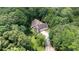 An aerial view of a secluded home surrounded by lush greenery at 7448 Berea Road, Winston, GA 30187