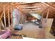 Large attic space with exposed brick and wooden beams, offering potential for conversion and versatile use at 7448 Berea Road, Winston, GA 30187