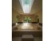 Luxurious bathroom with a sunken jetted tub, skylight, and tiled surround at 7448 Berea Road, Winston, GA 30187