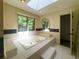 Elegant bathroom with a jetted tub, tiled surround, and a view of nature at 7448 Berea Road, Winston, GA 30187