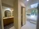 Bathroom featuring double sinks, walk-in closet, and tiled floors at 7448 Berea Road, Winston, GA 30187