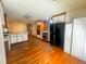 Kitchen with stainless steel appliances, wood cabinets, and hardwood flooring at 7448 Berea Road, Winston, GA 30187