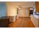 Kitchen leading to the eat-in area, showcasing wood floors and cabinets at 7448 Berea Road, Winston, GA 30187