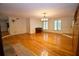 Spacious living room featuring hardwood floors, piano, and large windows at 7448 Berea Road, Winston, GA 30187
