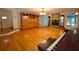 Inviting living room featuring hardwood floors, stone fireplace, and large built-in cabinetry at 7448 Berea Road, Winston, GA 30187