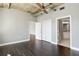 Spacious bedroom with closet and bathroom doors, hardwood floors, and gray walls at 115 W Peachtree Nw Pl # 602, Atlanta, GA 30313