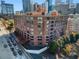 A full exterior shot of a beautiful red brick apartment building in the middle of the city at 115 W Peachtree Nw Pl # 602, Atlanta, GA 30313