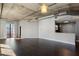 Open-concept living space with hardwood floors, exposed ductwork, and access to the kitchen and views at 115 W Peachtree Nw Pl # 602, Atlanta, GA 30313
