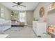 Charming Bedroom with a crib, daybed, colorful decor, and ample space for play and relaxation at 2075 Old Georgian Nw Ter, Atlanta, GA 30318