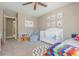Bright Bedroom features a crib, books, area rug, and wall art, creating a playful and inviting space at 2075 Old Georgian Nw Ter, Atlanta, GA 30318