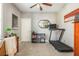 Neutral-toned bedroom featuring a ceiling fan, decor, and a treadmill for at-home workouts at 2075 Old Georgian Nw Ter, Atlanta, GA 30318