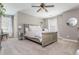 Neutral bedroom featuring a spacious layout, ceiling fan, windows with bright light, and carpeted floors at 2075 Old Georgian Nw Ter, Atlanta, GA 30318