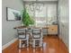 Cozy dining area featuring a modern light fixture, comfortable seating, and natural light at 2075 Old Georgian Nw Ter, Atlanta, GA 30318