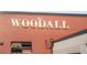Exterior view of The Woodall restaurant with brick facade at 2075 Old Georgian Nw Ter, Atlanta, GA 30318