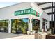 Exterior view of Spiller Park Coffee shop, featuring large windows and outdoor seating at 2075 Old Georgian Nw Ter, Atlanta, GA 30318