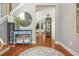 Inviting foyer with hardwood floors, a round rug, and a view into the living spaces at 2075 Old Georgian Nw Ter, Atlanta, GA 30318