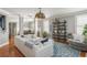 Bright living room with hardwood floors, stylish furniture, and an open concept design at 2075 Old Georgian Nw Ter, Atlanta, GA 30318