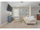 Comfortable living room showcases neutral tones, a cozy couch and a wall-mounted TV at 2075 Old Georgian Nw Ter, Atlanta, GA 30318