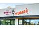 Exterior of YumBi! Taco Shop and The Queso Shop, with vibrant signage at 2075 Old Georgian Nw Ter, Atlanta, GA 30318