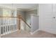View of staircase with white railing and grey walls leading to a window at 2075 Old Georgian Nw Ter, Atlanta, GA 30318