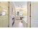 Bathroom with glass enclosed shower, fireplace, vanities, and soaking tub at 2584 Oglethorpe Ne Cir, Brookhaven, GA 30319