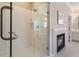 Shower area with glass door and fireplace viewed from bathroom at 2584 Oglethorpe Ne Cir, Brookhaven, GA 30319