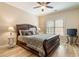 Cozy bedroom with hardwood floors, ceiling fan, and large window that allows natural light to illuminate the room at 2584 Oglethorpe Ne Cir, Brookhaven, GA 30319