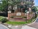 Brick sign at Brookhaven Township features flowers and landscaping in a well-maintained community at 2584 Oglethorpe Ne Cir, Brookhaven, GA 30319