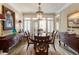 Formal dining room with wood furniture, neutral walls, and direct access to an outdoor patio at 2584 Oglethorpe Ne Cir, Brookhaven, GA 30319