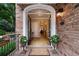 Inviting entrance with double doors opening to a bright foyer and hardwood floors at 2584 Oglethorpe Ne Cir, Brookhaven, GA 30319