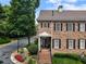 Exterior of a well-maintained two-story red brick house with a lush green lawn and landscaping at 2584 Oglethorpe Ne Cir, Brookhaven, GA 30319