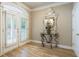 Bright foyer featuring hardwood floors, elegant console table, and stylish decor at 2584 Oglethorpe Ne Cir, Brookhaven, GA 30319