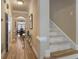Hallway view featuring hardwood floors, stairway, and glass top console table at 2584 Oglethorpe Ne Cir, Brookhaven, GA 30319