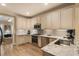 Well-lit kitchen featuring granite countertops, stainless steel appliances, and custom cabinets at 2584 Oglethorpe Ne Cir, Brookhaven, GA 30319