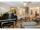 Cozy living room with hardwood floors, comfortable seating, and a grand piano at 2584 Oglethorpe Ne Cir, Brookhaven, GA 30319