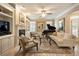 Spacious living room featuring a fireplace, built-in shelving, and a grand piano at 2584 Oglethorpe Ne Cir, Brookhaven, GA 30319
