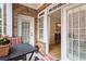 Covered patio with seating area, offering seamless indoor-outdoor living and natural light at 2584 Oglethorpe Ne Cir, Brookhaven, GA 30319